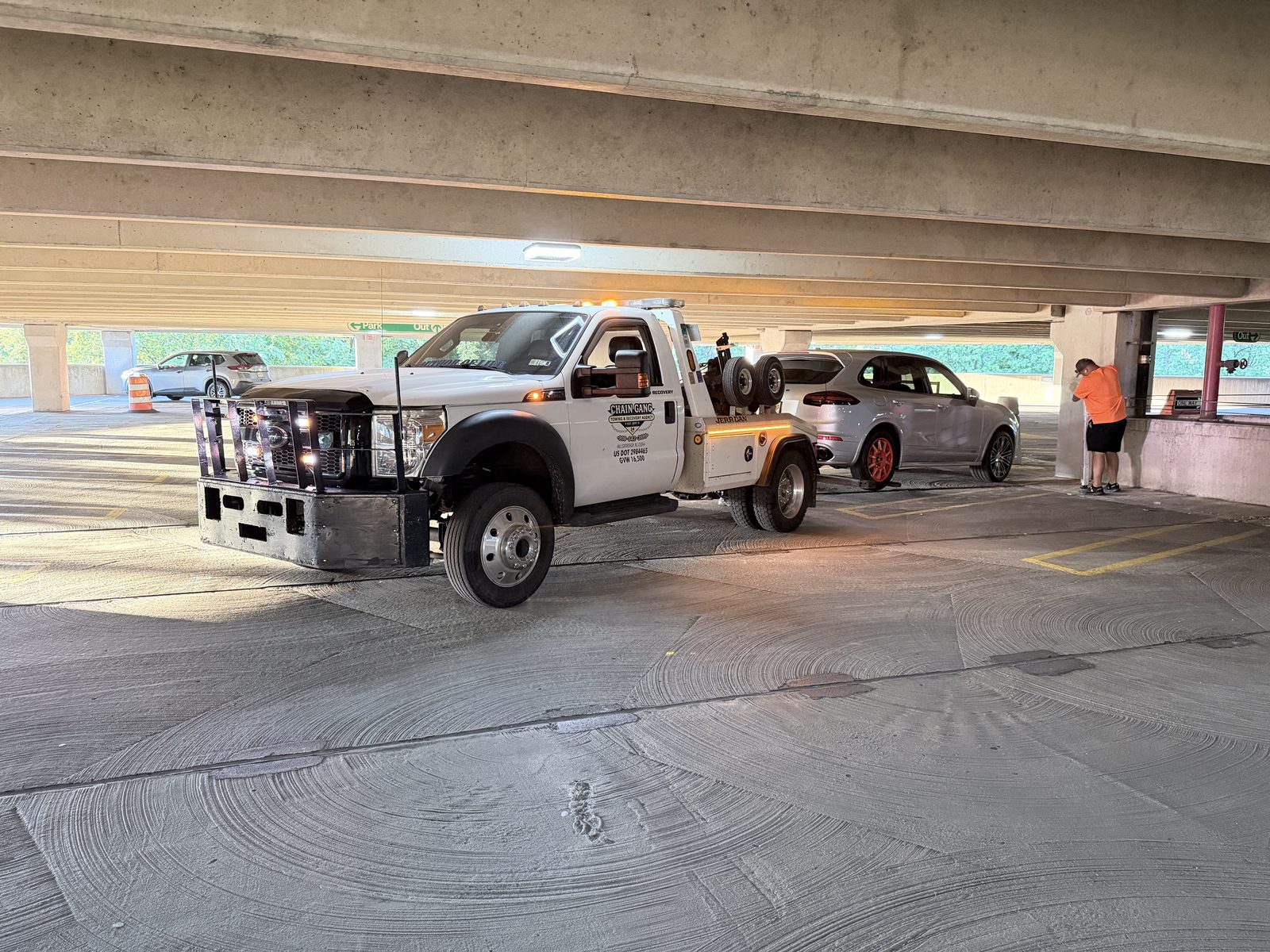 Low-clearance parking garage vehicle extraction by Chain Gang Towing